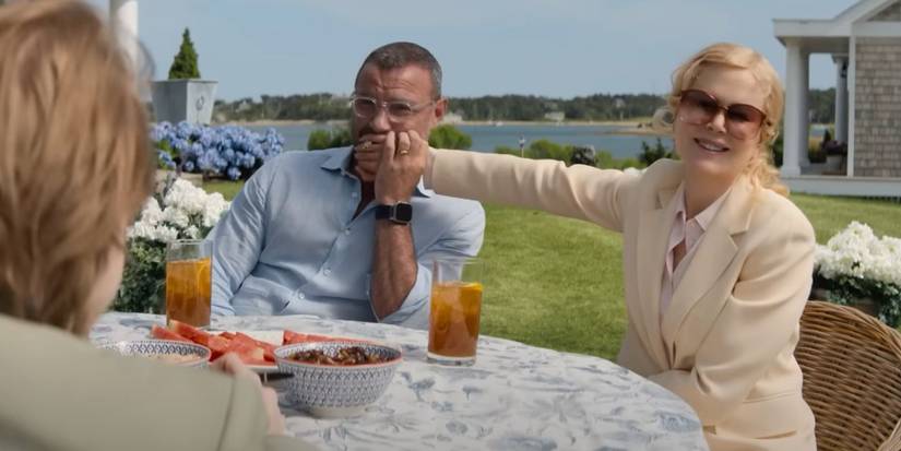 Tag (Liev Schreiber) and Greer (Nicole Kidman) smile at an outdoor brunch in The Perfect Couple.