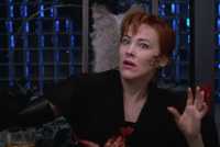 Delia Deetz (Catherine O'Hara) gets possessed for a musical number in Beetlejucie (1988).