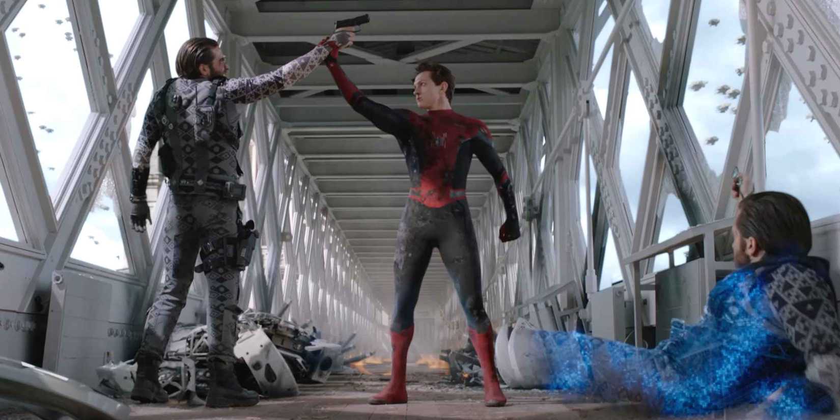 Spider-Man grabbing Mysterio's arm and moving his gun away, while a Mysterio illusion lay on the ground.