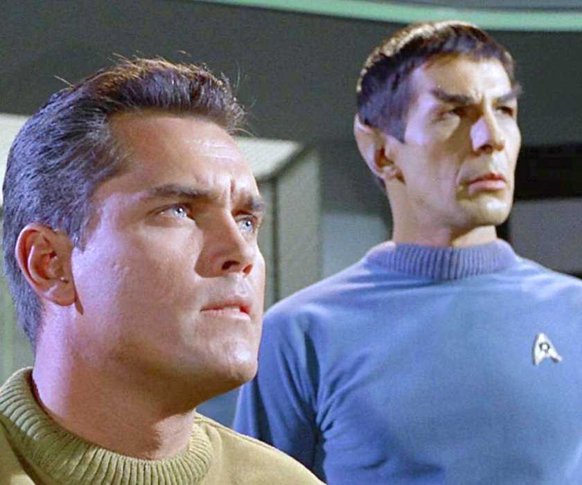Captain Pike and Spock on the bridge looking ahead at something offscreen in Star Trek: The Original Series