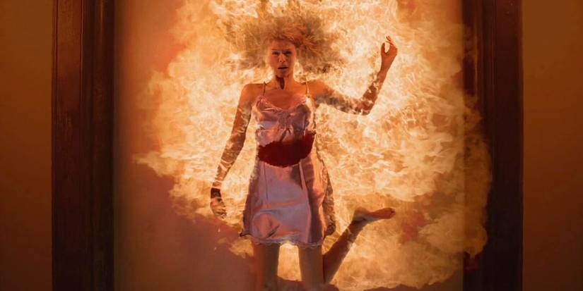 Jessica (Adrianne Palicki) on a ceiling engulfed in flames in the pilot episode of Supernatural.
