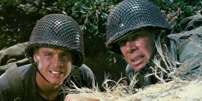 Mark Hamil as Private Griff and Lee Marvin The Sargent peaking out from cover in The Big Red One
