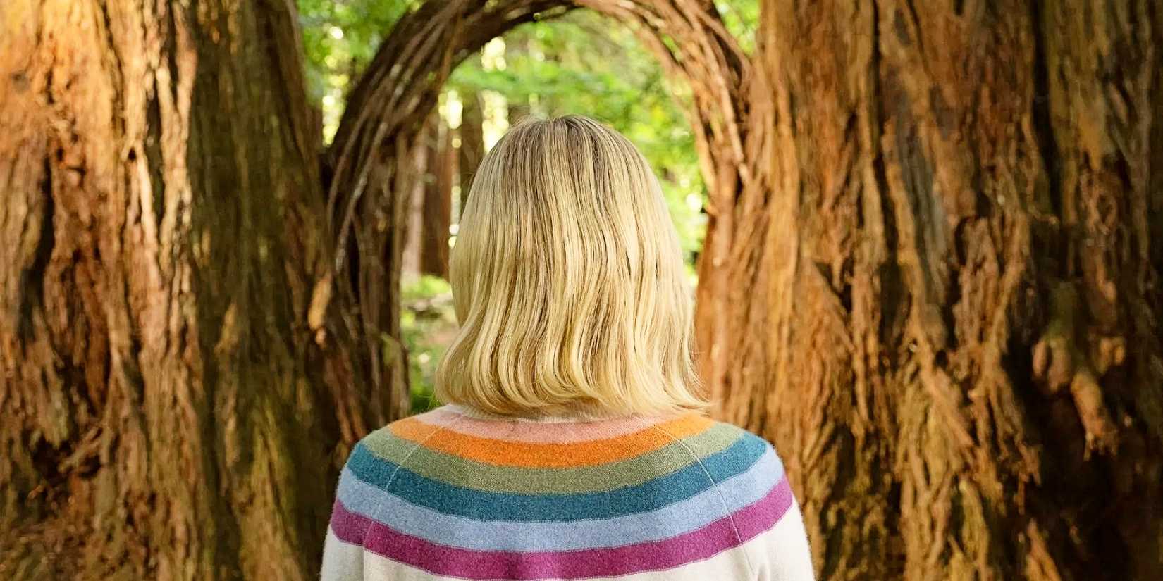 Eleanor Shellstrop's back as she walks through the afterlife door in The Good Place series finale.
