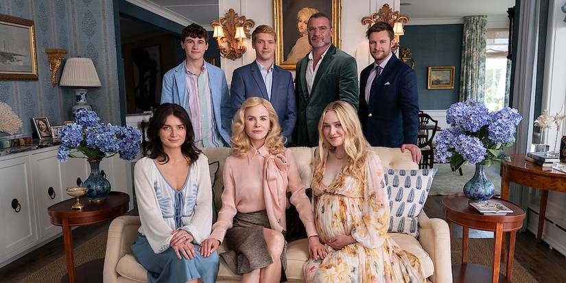 The cast for The Perfect Couple pose together in a lavish living room.