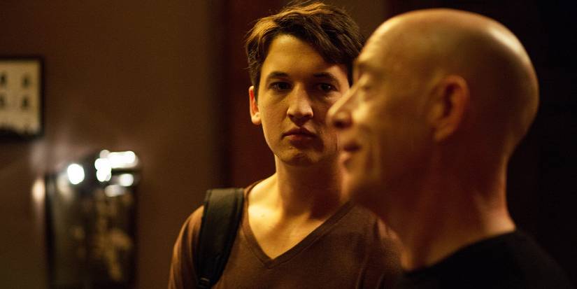 Miles Teller as Andrew as looking intensely at JK Simmons as Terence who's out of focus