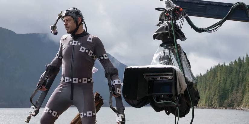 Andy Serkis as Caesar, in a motion-capture suit with a camera crane nearby, in a behind-the-scenes photo.