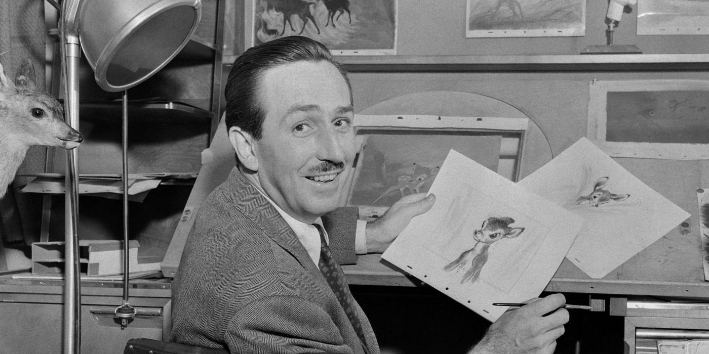 Walt Disney holding up a drawing of Bambi 