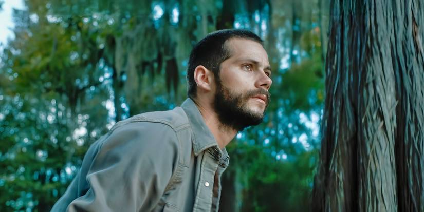 Dylan O'Brien as Paris looking to the distance in Caddo Lake