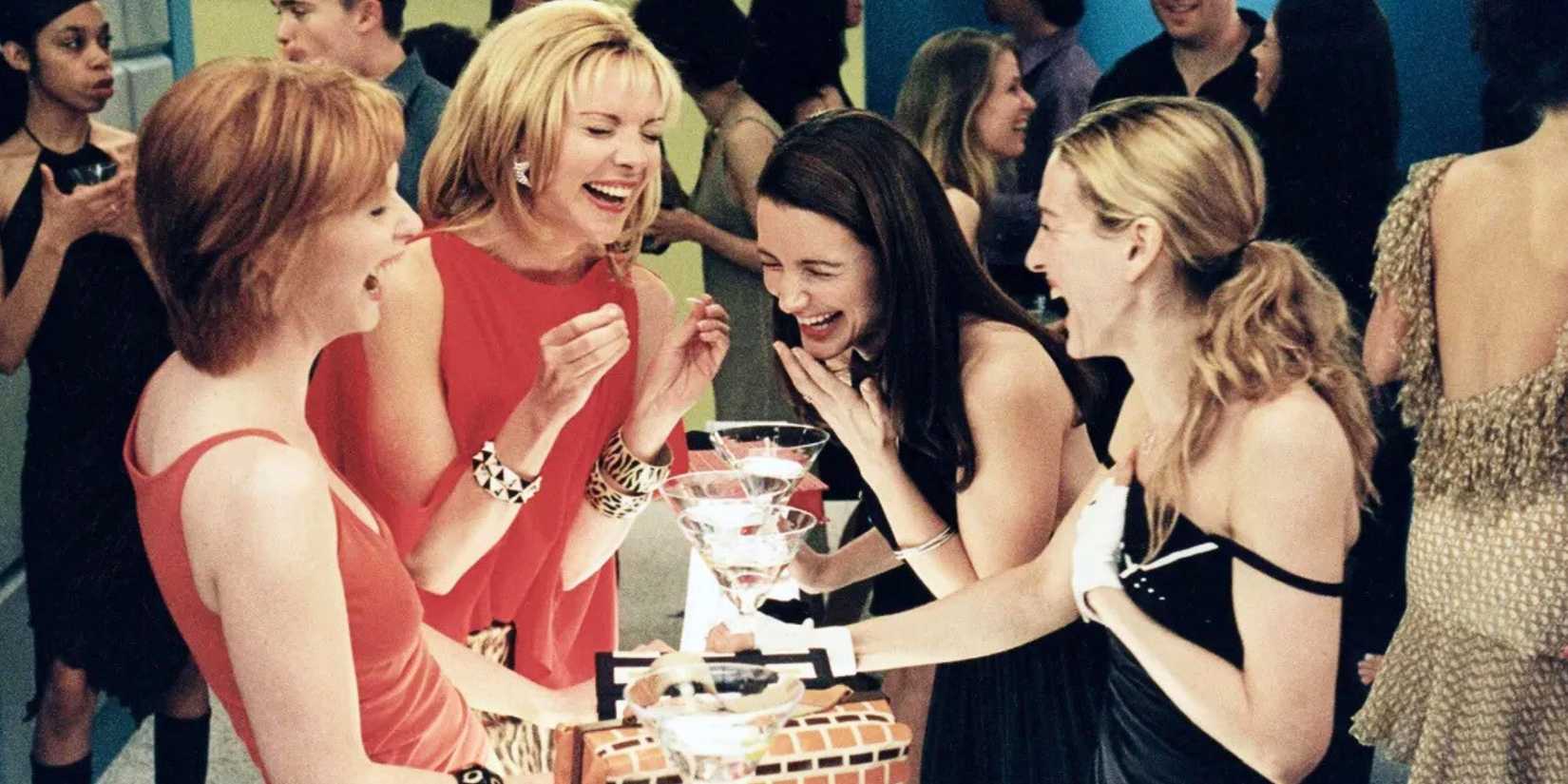 Cynthia Nixon, Kim Cattrall, Kristin Davis, and Sarah Jessica Parker laughing in Sex and the City.