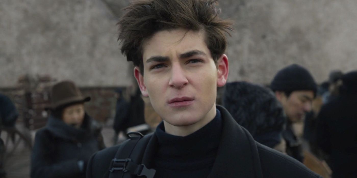 David Mazouz squints at something off camera as Bruce Wayne in Gotham. 