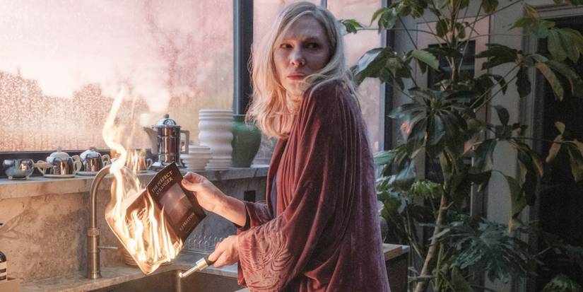 Cate Blanchett as Catherine burning a book over the sink in the Apple TV+ series Disclaimer.