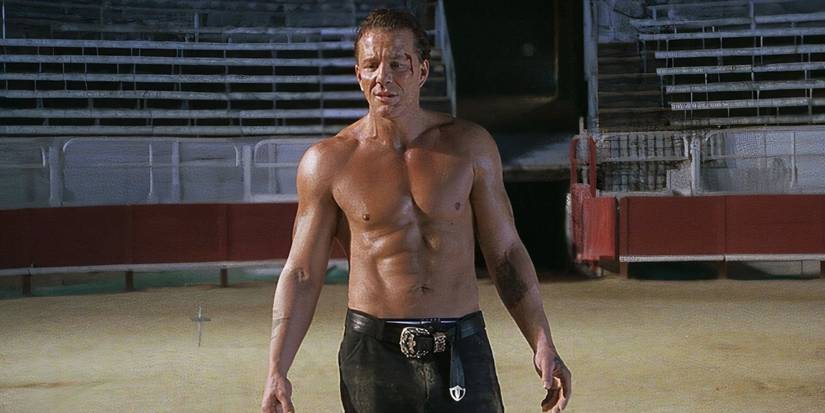A man with blood on his face in 'Double Team' (1997)