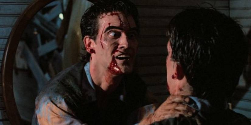 Ash Williams choking a man in Evil Dead II