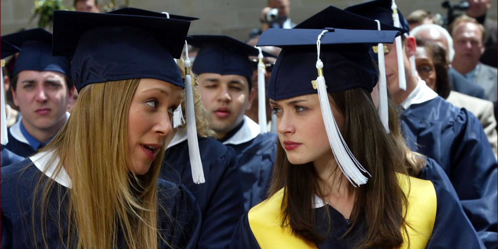 Rory and Paris wearing graduation clothes in Gilmore Girls