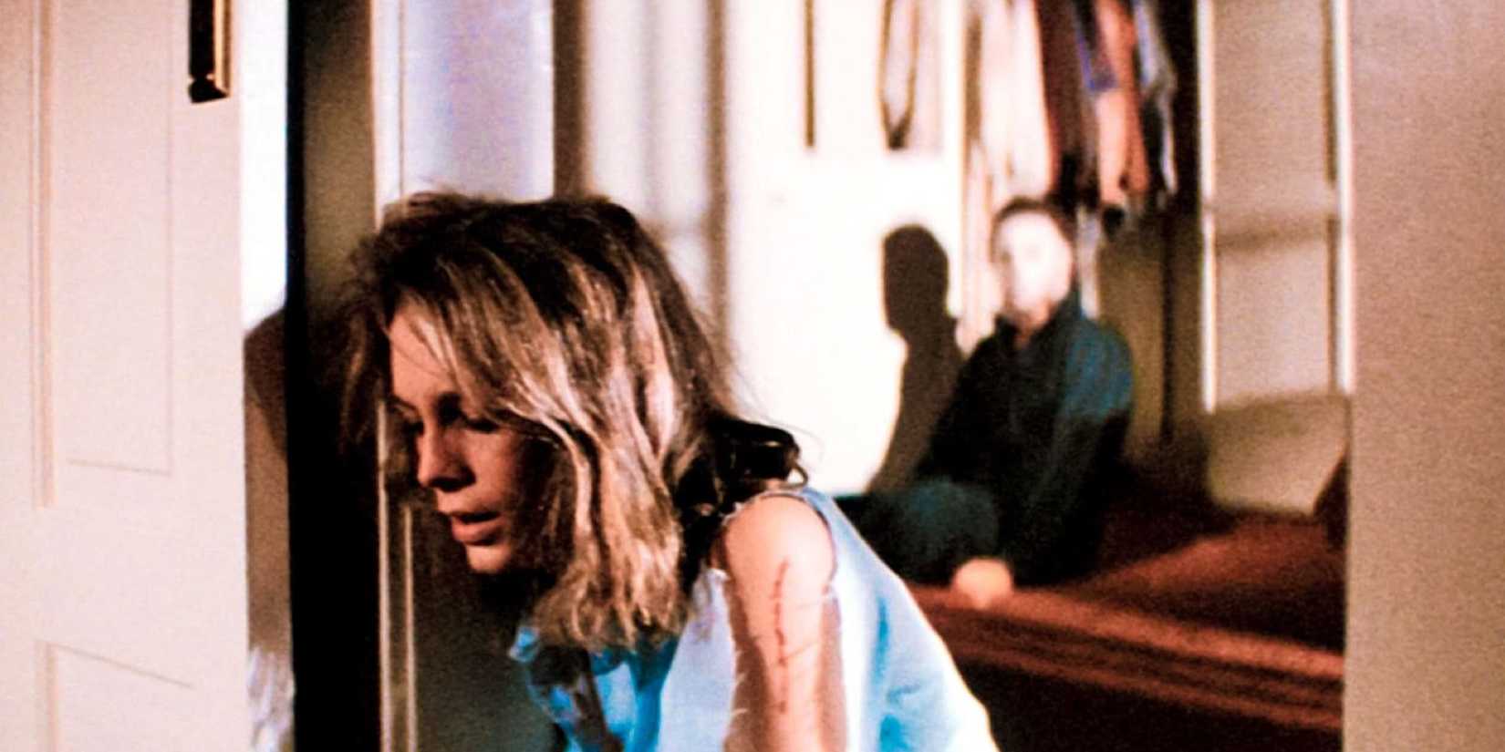 Michael Myers lurks behind Laurie Strode in the final moments of Halloween.
