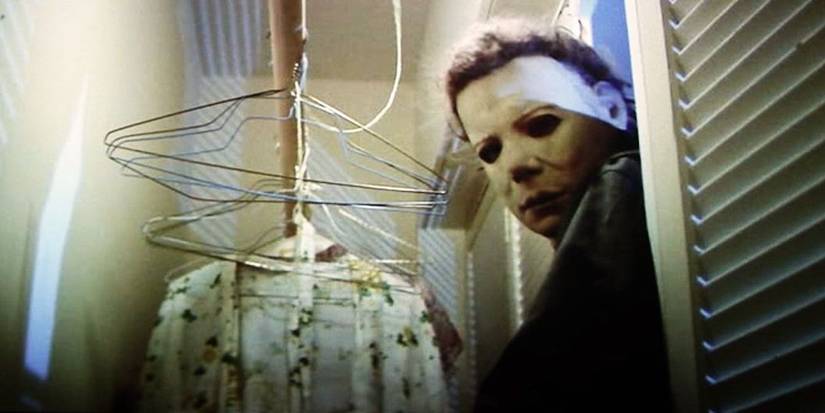 Nick Castle as Michael Myers slashing his way into a closet in Halloween
