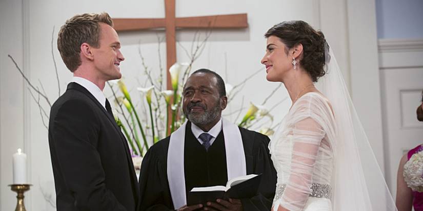 Barney and Robin stand facing each other as they prepare to get married in 'How I Met Your Mother'