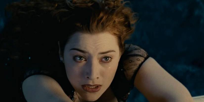 Rose (Kate Winslet) hanging over the side of the Titanic trying to hold on in 'Titanic'
