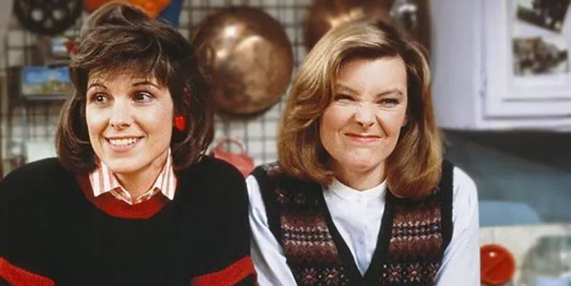 Kate and Allie sitting on a couch looking surprised in Kate & Allie.