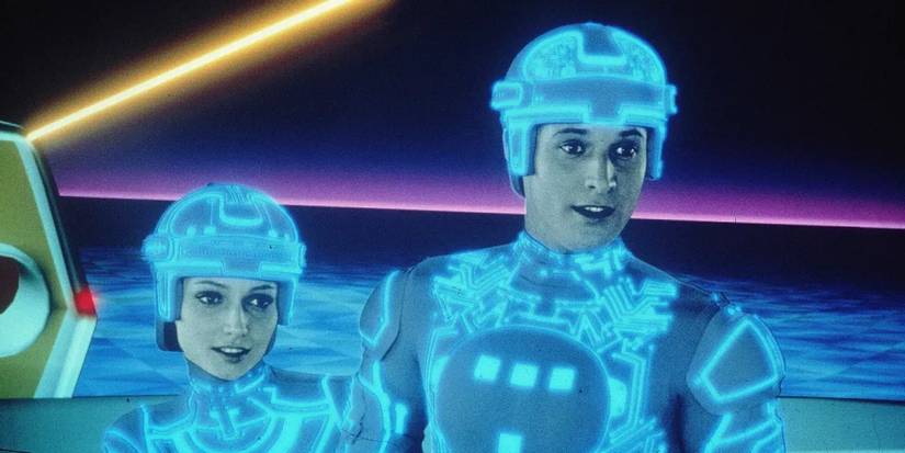 Lora (Cindy Morgan) dan Alan Bradley (Bruce Boxleitner) berdiri bersama di 'Tron' tahun 1982