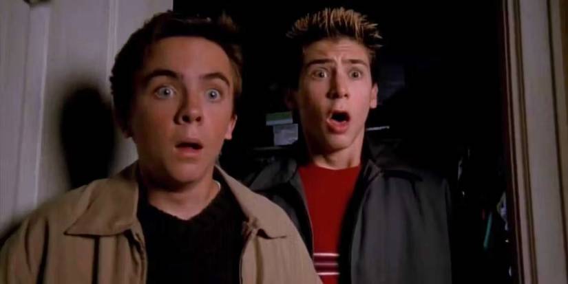 Malcolm and Reese stand in front of a closet and looked shocked in Malcolm in the Middle.