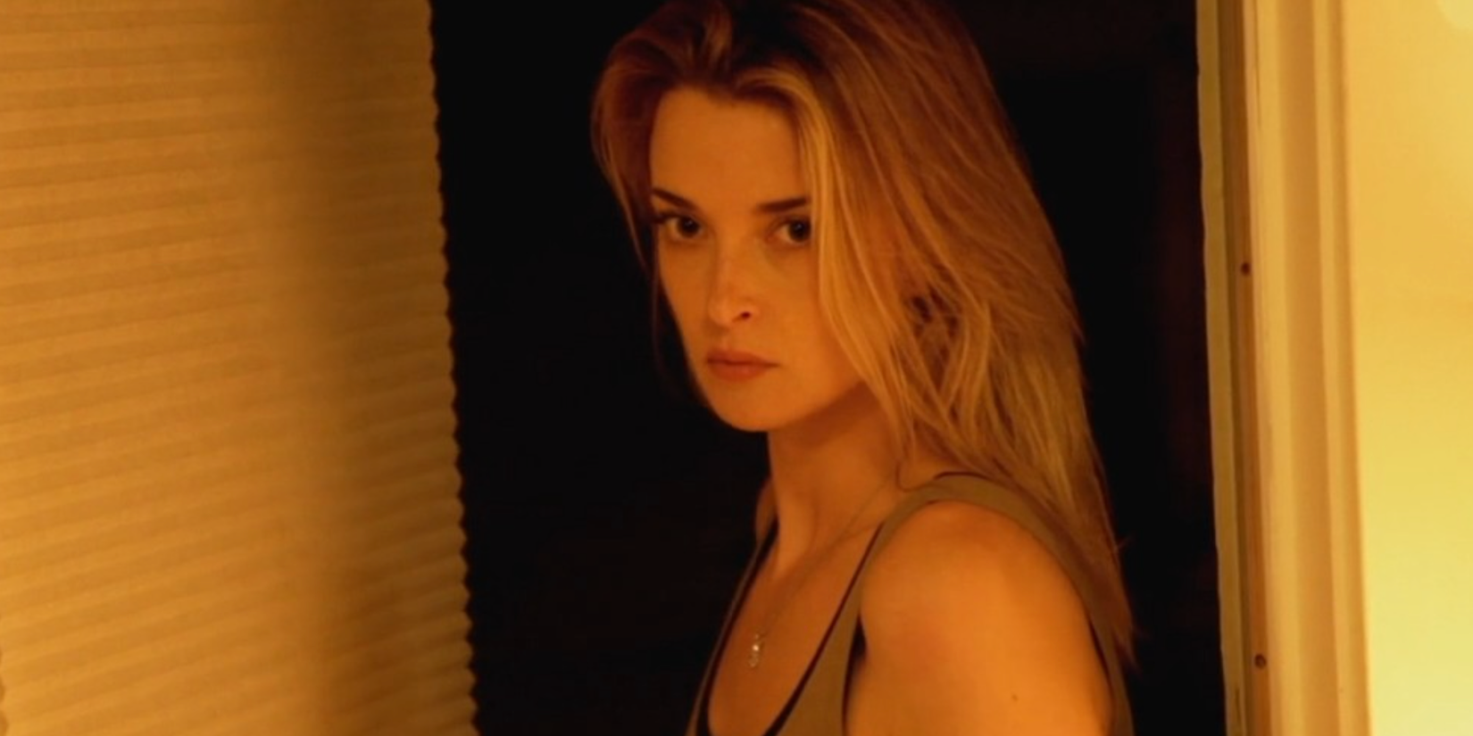 A young woman looking intently ahead in Coherence