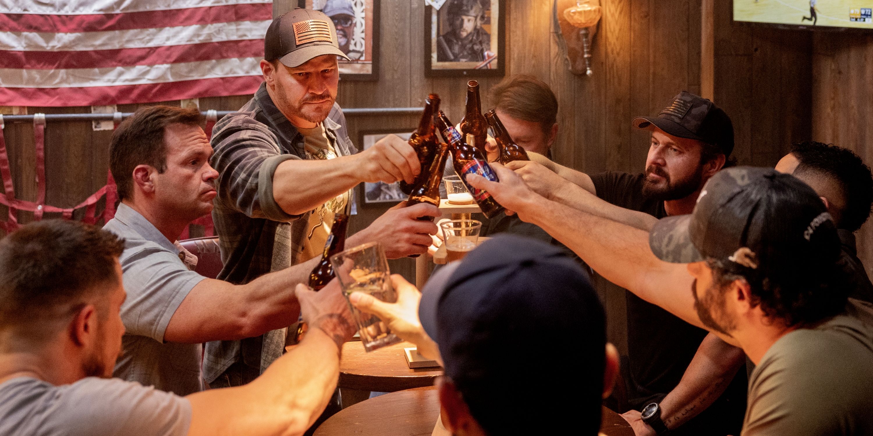 David Boreanaz as Jason Hayes clinking beer bottles with BRAVO Team in the series finale of SEAL Team