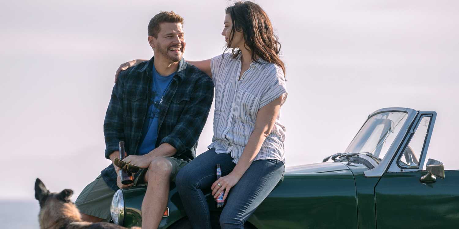 David Boreanaz as Jason Hayes sitting on the hood of his car with his wife in the series finale of SEAL Team