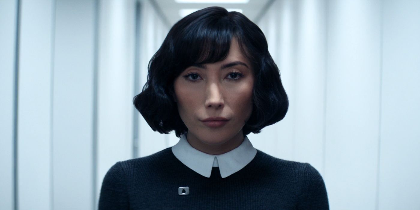 Dichen Lachman as Ms. Casey walks down a hallway in Severance Season 2.