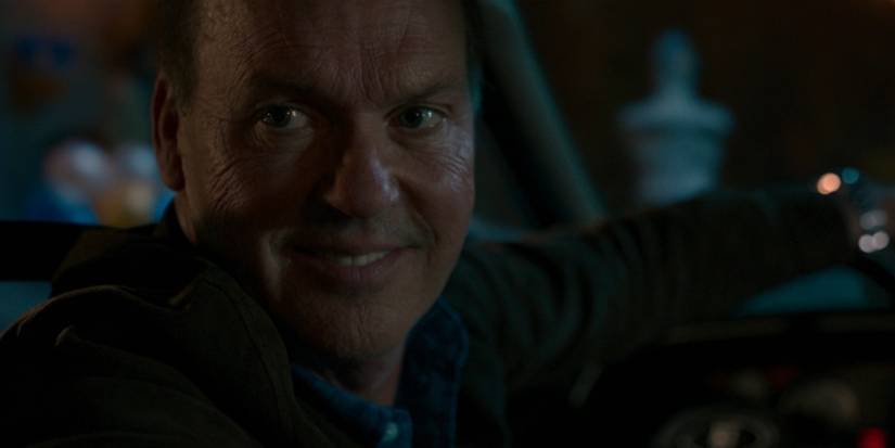 Adrian Toomes, AKA the Vulture, smiles while looking into the backseat of his car in 'Spider-Man: Homecoming'.