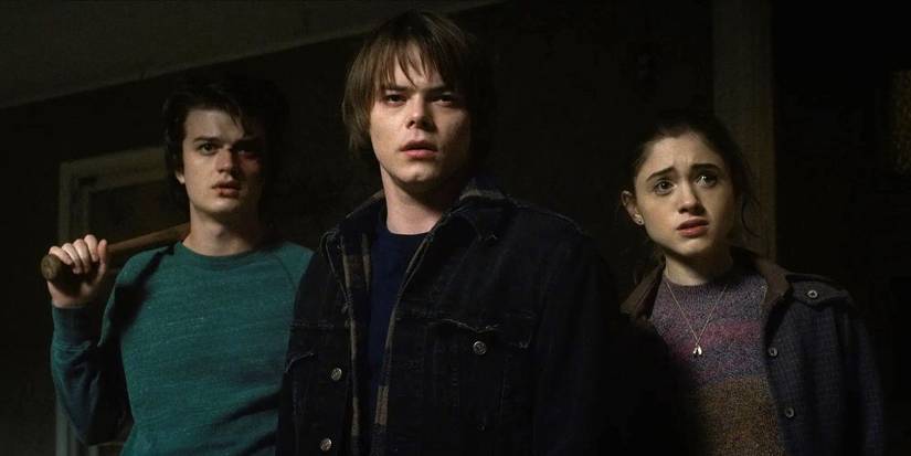 Steve, Jonathan, and Nancy standing in shock in Stranger Things.