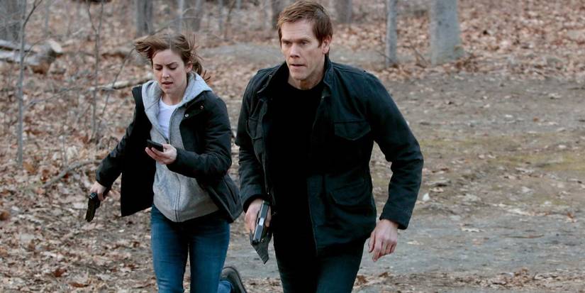 Max (Jessica Stroup) and Ryan Hardy (Kevin Bacon) run in the woods in The Following