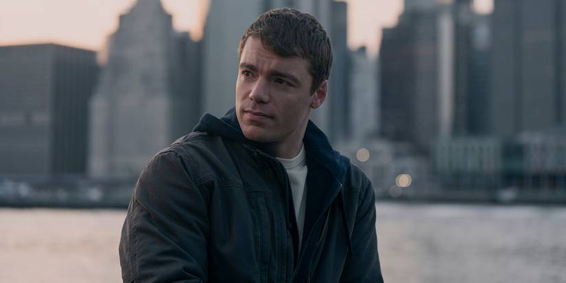 Gabriel Basso in The Night Agent Season 2 in front of a cityscape