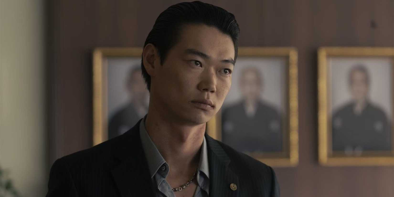 Chihara-kai member, Sato, played by Show Kasamatsu, looking off-screen in Tokyo Vice, Season 2.