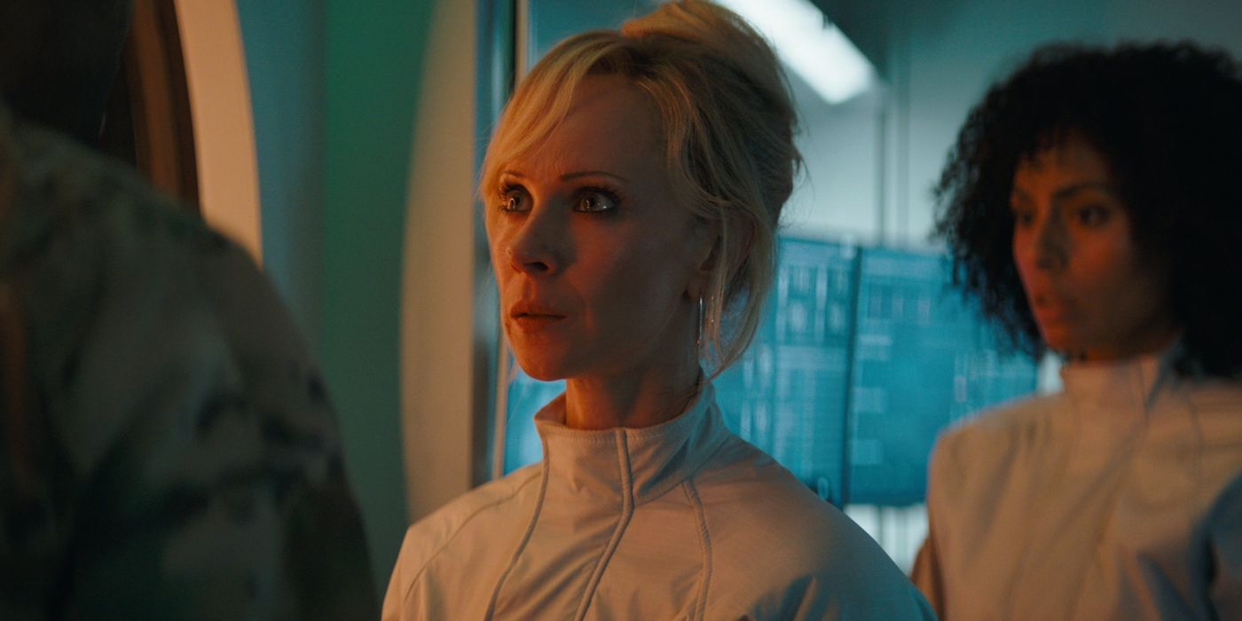 Juno Temple as the character Dr Payne looking startled in a laboratory in the movie Venom: The Last Dance