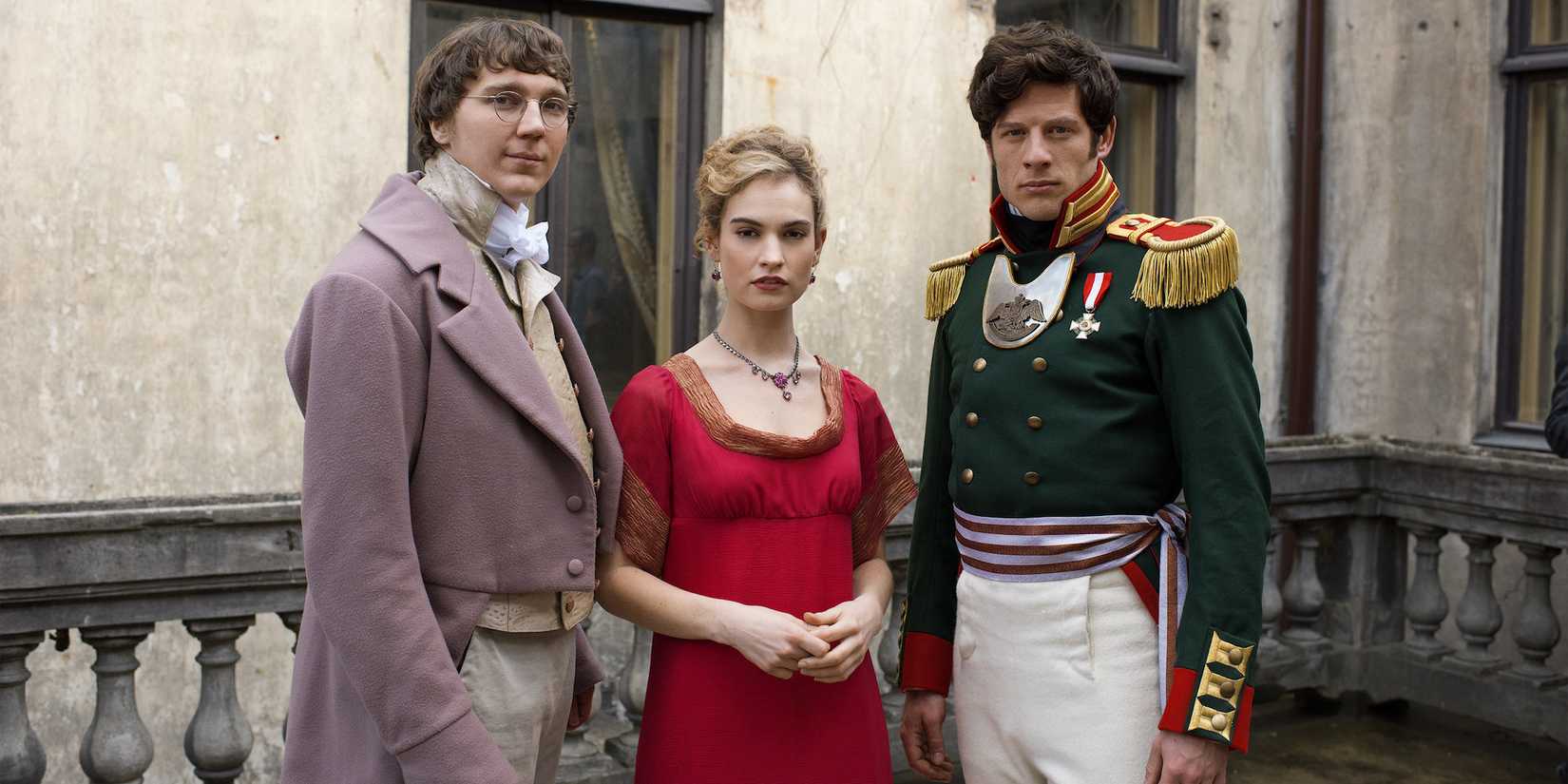 Paul Dano, Lily James, and James Norton in period outfits looking at the camera for War and Peace.