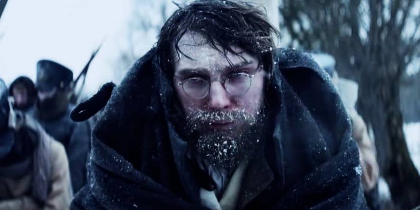 A miserable Paul Dano walking outdoors in Russian winter in 'War and Peace.'