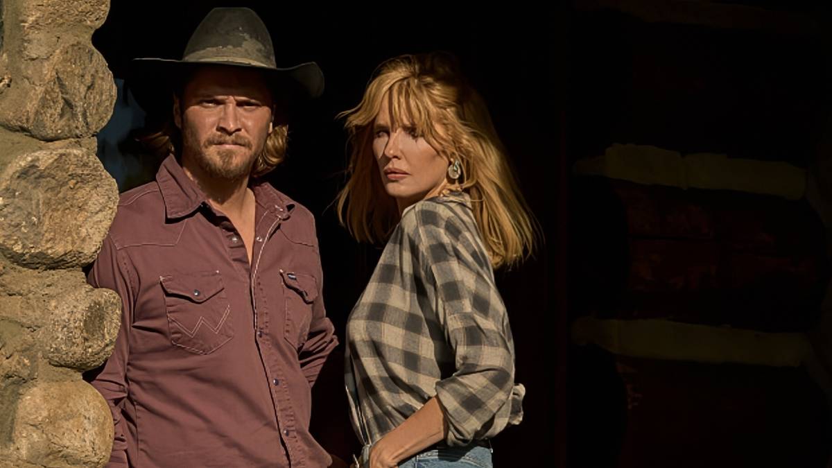 Luke Grimes as Kayce Dutton and Kelly Reilly as Beth Dutton standing on the front porch of the ranch in Yellowstone Season 5