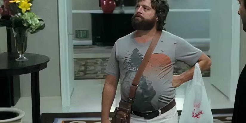Zach Galifianakis as Alan standing with his hands on his waist looking up in The Hangover.