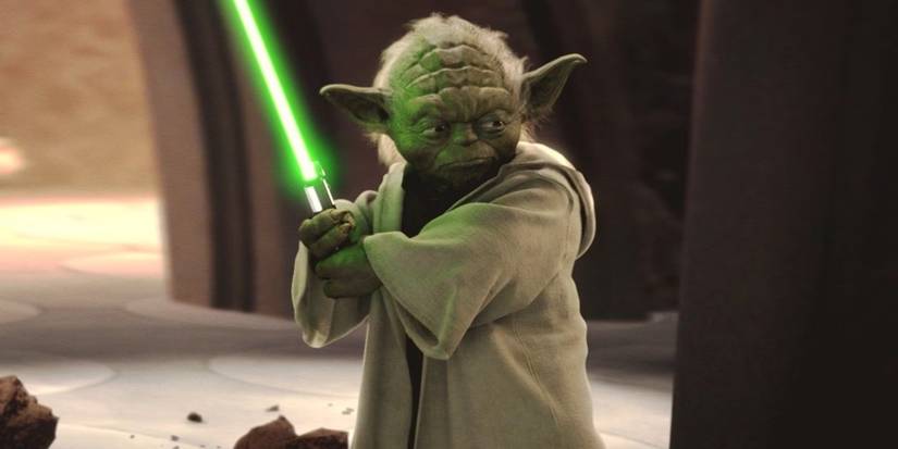 Master Yoda stands poised with his green lightsaber in 'Star Wars: Episode II - Attack of the Clones' (2002).