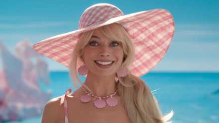 Barbie, played by Margot Robbie, smiles in 'Barbie'.
