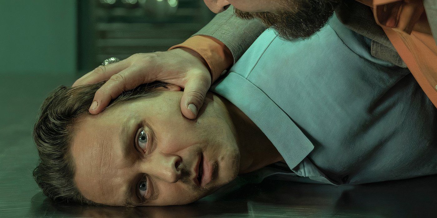 Bjorn played by Tom Schilling being held on the floor in Murder Mindfully