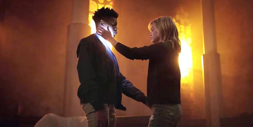 Tandy/Dagger, played by Olivia Holt uses her powers to heal Cloak (Aubrey Joseph) in Cloak and Dagger.