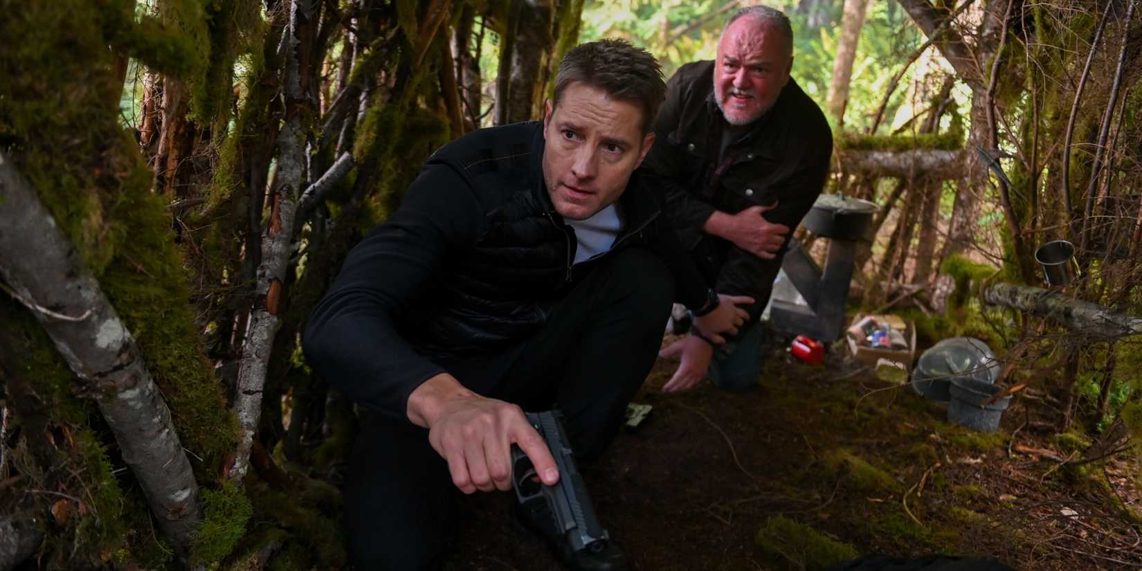 Colter Shaw (Justin Hartley) and Keaton (Brent Saxton) investigating in the woods on 'Tracker'
