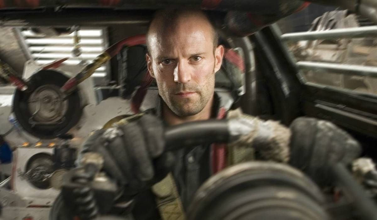 Dystopian gladiatorial race track stadium with explosive car crashes in Death Race movie