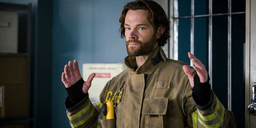 Jared Padalecki raises his hands as Camden Casey on Fire Country.
