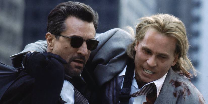 Robert De Niro assisting a wounded Val Kilmer down the street in Heat
