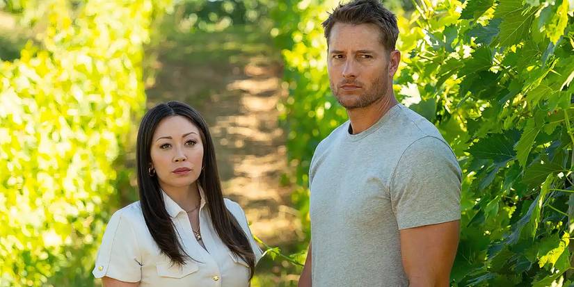 Fiona Rene as Reenie and Justin Hartley as Colter standing in a field on 'Tracker' .