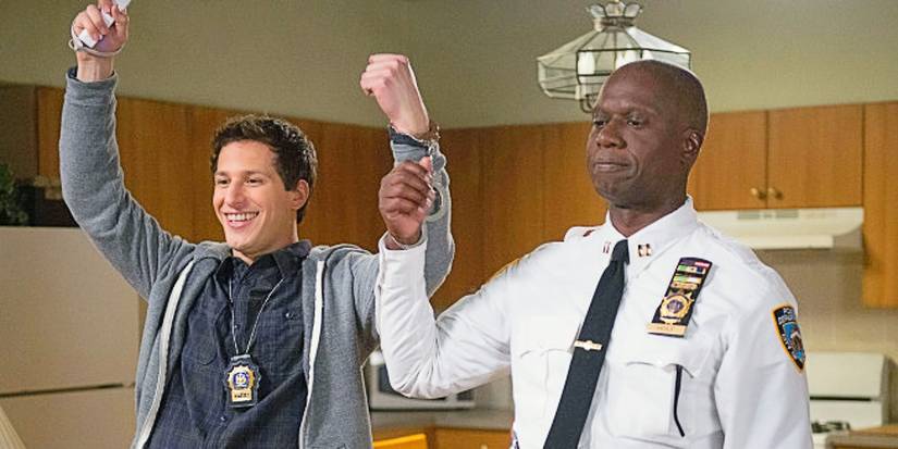 Jake Peralta and Captain Holt handcuffed together in Brooklyn Nine-Nine Season 1 Christmas episode.