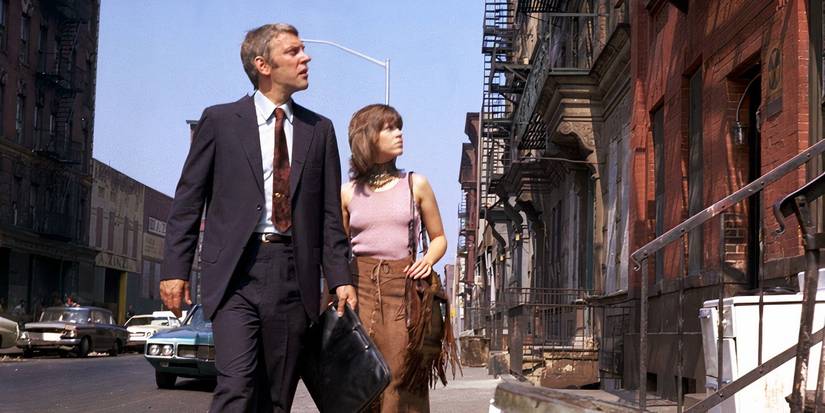 Donal Sutherland and Jane Fonda walking down a street in Klute